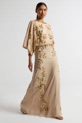 Ambretta Nude Embellished Maxi Dress by Frock and Frill – modest evening gown with long sleeves and gold detailing, perfect for weddings and formal events.