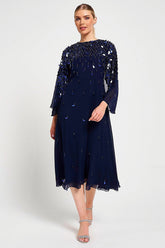 Annette navy embellished cape sleeve midi dress with tonal sequin detailing and flowing silhouette designed for elegant wedding guest and occasion wear styling