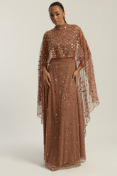 Elysia cape sleeve maxi dress with sequins and flowing silhouette for weddings and formal events.