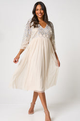 Kathryn nude sequin midi dress with embellished bodice and sleeves, V neckline and fit-and-flare silhouette designed for elegant occasion wear styling