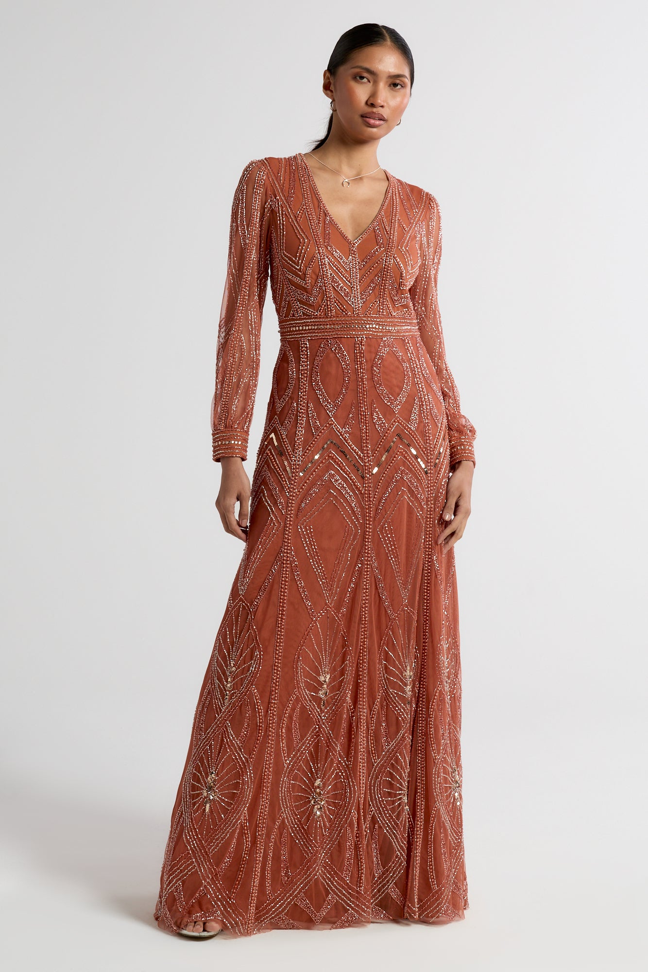 Amber burnt orange embellished maxi dress with V-neckline and long sleeves