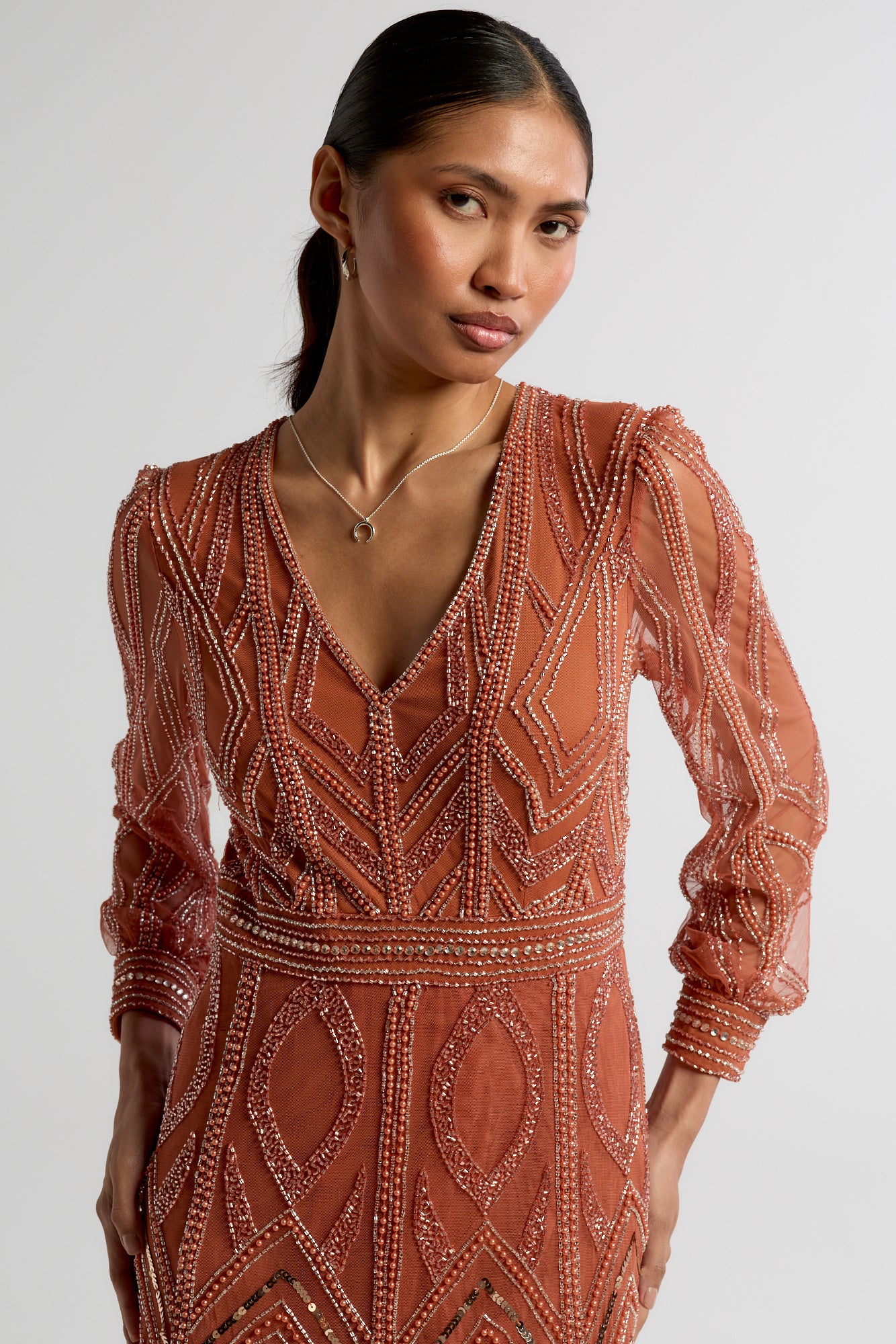 Amber burnt orange embellished maxi dress with V-neckline and long sleeves