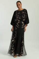 Black maxi dress with gold sequin floral embellishment, flowing sheer sleeves and full-length silhouette, Ambretta by Frock and Frill.