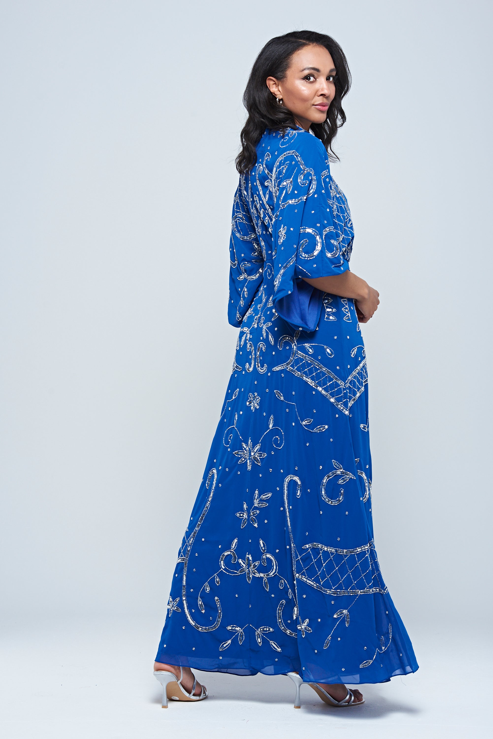 Blue Aramina Maxi Dress by Frock and Frill, featuring elegant silver beadwork and a modest floor-length silhouette, perfect for weddings and evening events.