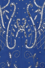 Blue Aramina Maxi Dress by Frock and Frill, featuring elegant silver beadwork and a modest floor-length silhouette, perfect for weddings and evening events.