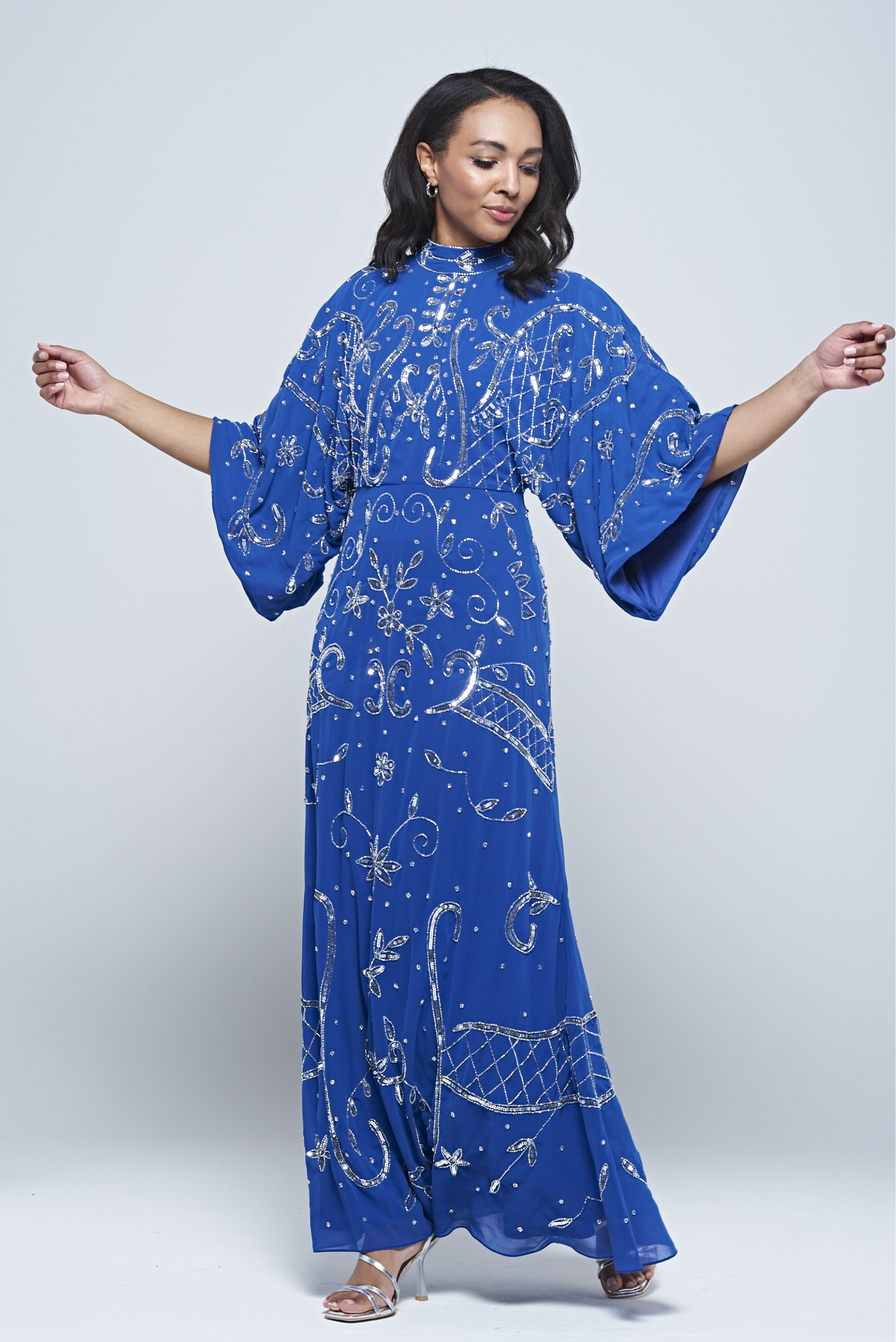 Blue Aramina Maxi Dress by Frock and Frill, featuring elegant silver beadwork and a modest floor-length silhouette, perfect for weddings and evening events.