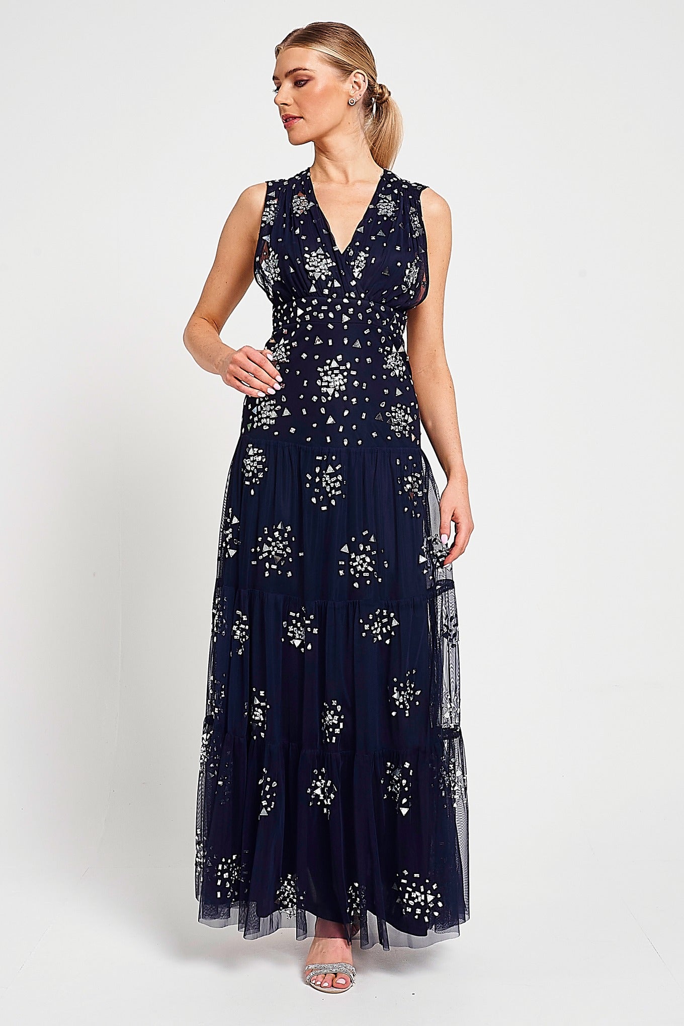 Aveline navy embellished sleeveless maxi dress with v-neck bodice, silver beadwork and tiered skirt, full-length formal occasion dress