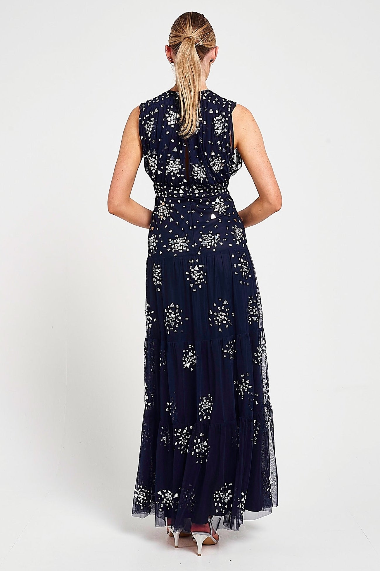 Aveline navy embellished sleeveless maxi dress with v-neck bodice, silver beadwork and tiered skirt, full-length formal occasion dress