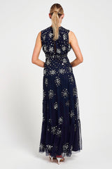Aveline navy embellished sleeveless maxi dress with v-neck bodice, silver beadwork and tiered skirt, full-length formal occasion dress