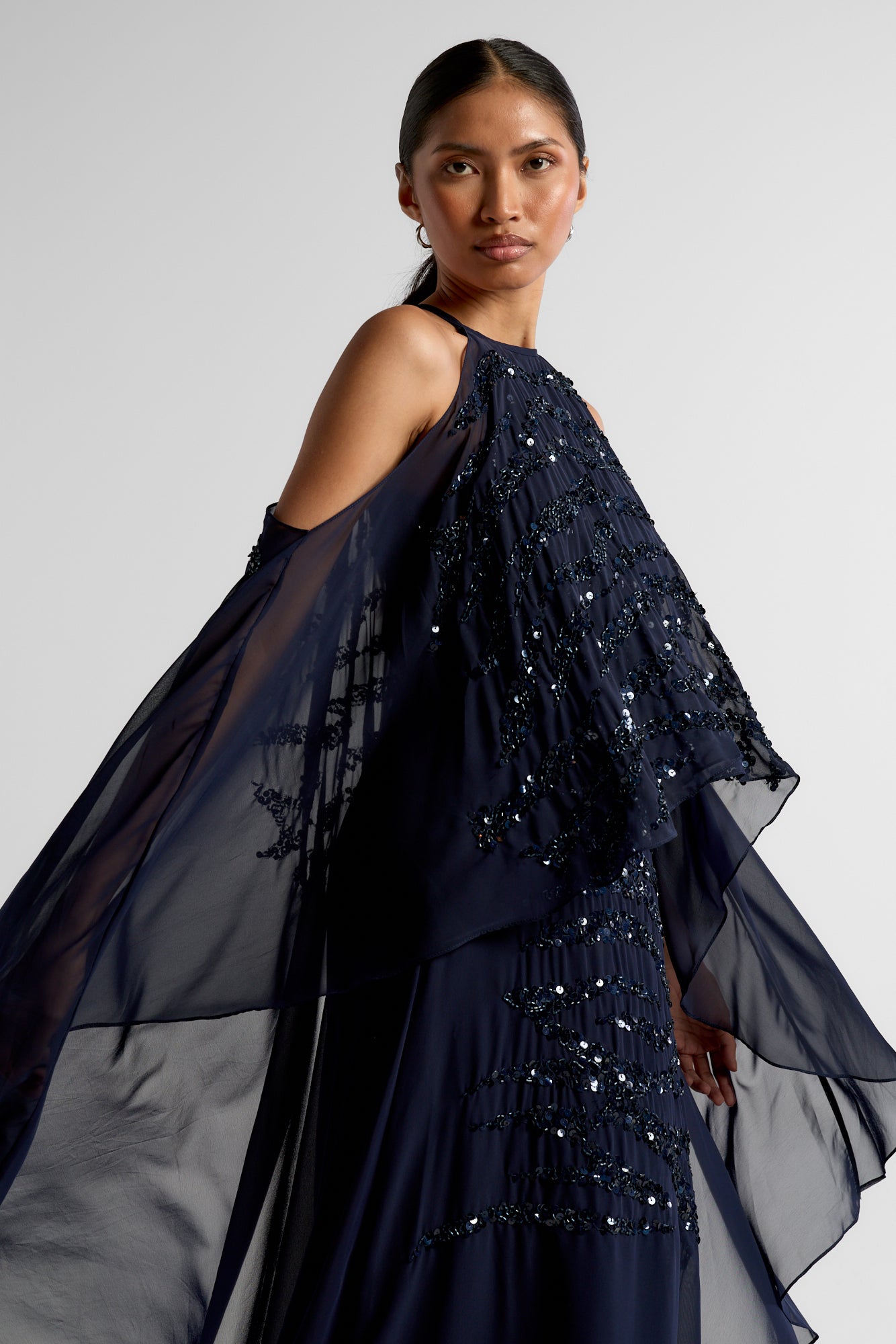 Colette Navy Embellished Cold Shoulder Maxi Dress with Cape Detail – Elegant formal evening gown suitable for bridesmaids, prom, or special occasions