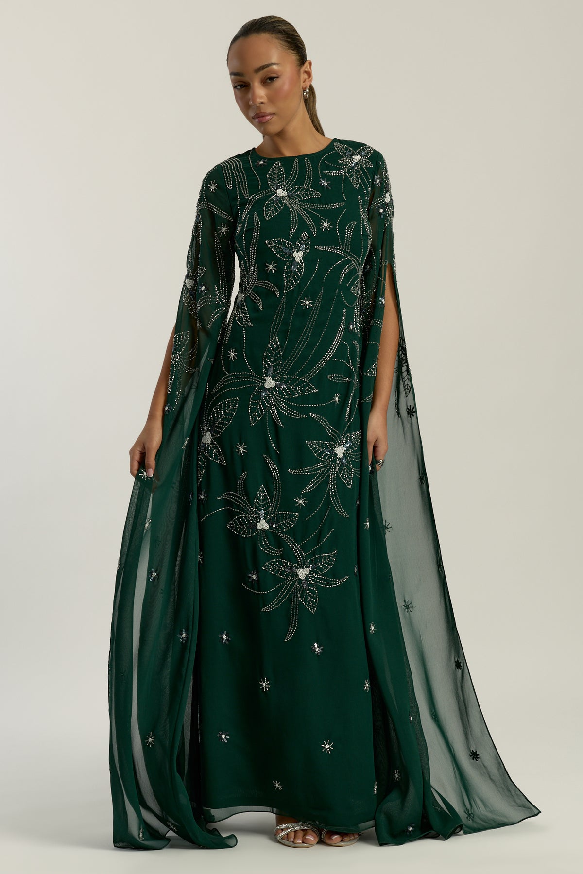 Eden green embellished cape sleeve maxi dress by Frock and Frill with delicate beadwork and a modest full-length silhouette
