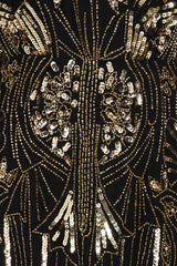 Elara black maxi dress with gold embellishment and sheer cape