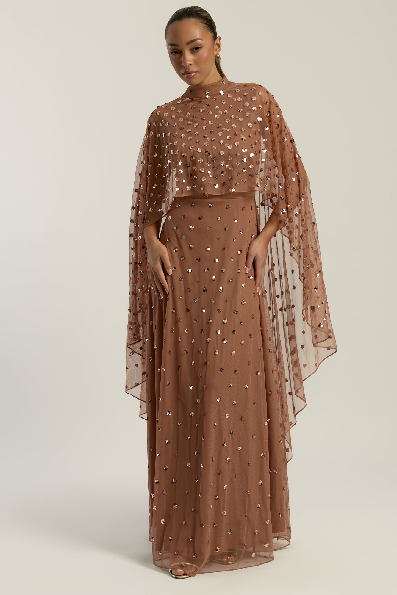 Elysia cape sleeve maxi dress with sequins and flowing silhouette for weddings and formal events.