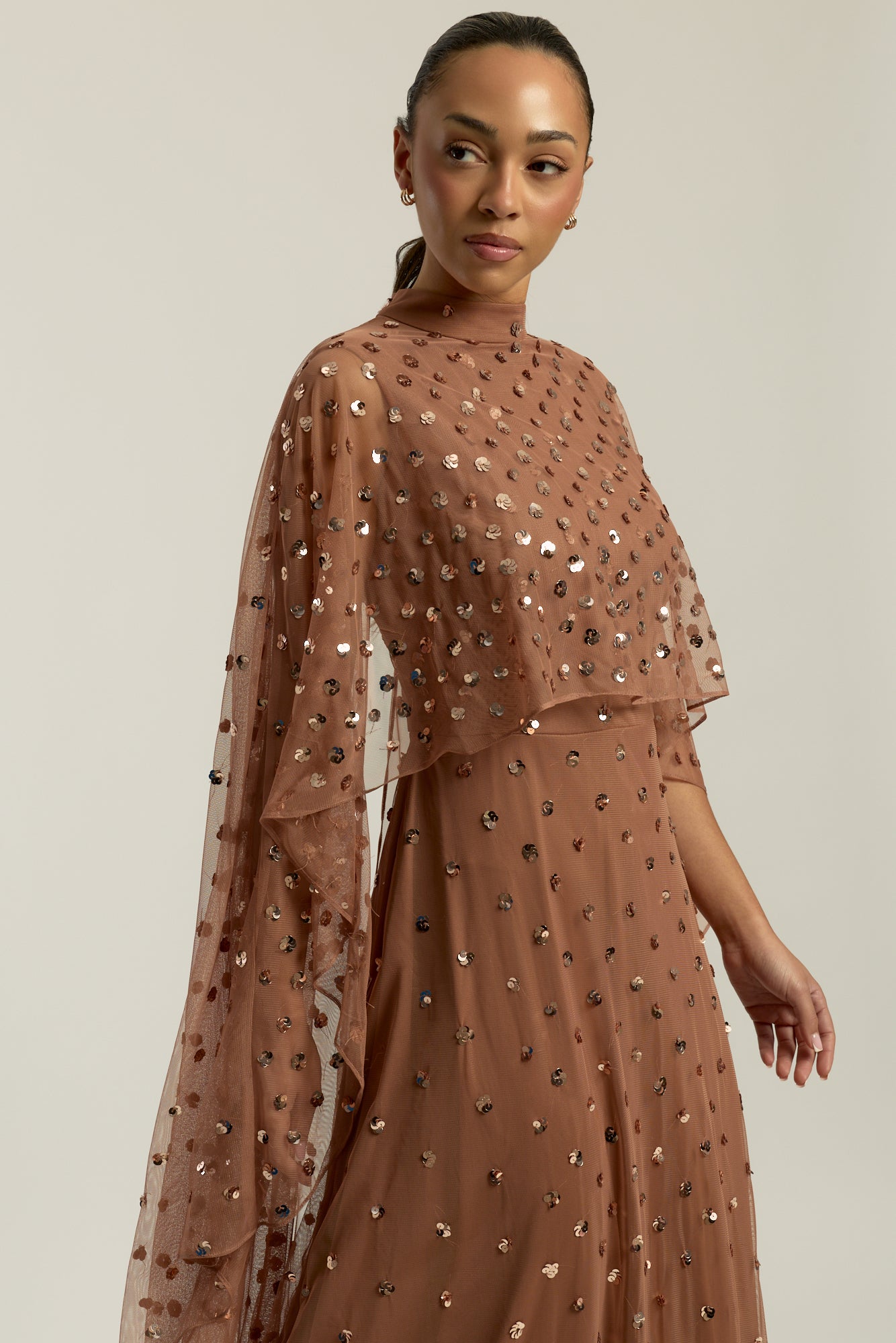 Elysia cape sleeve maxi dress with sequins and flowing silhouette for weddings and formal events.