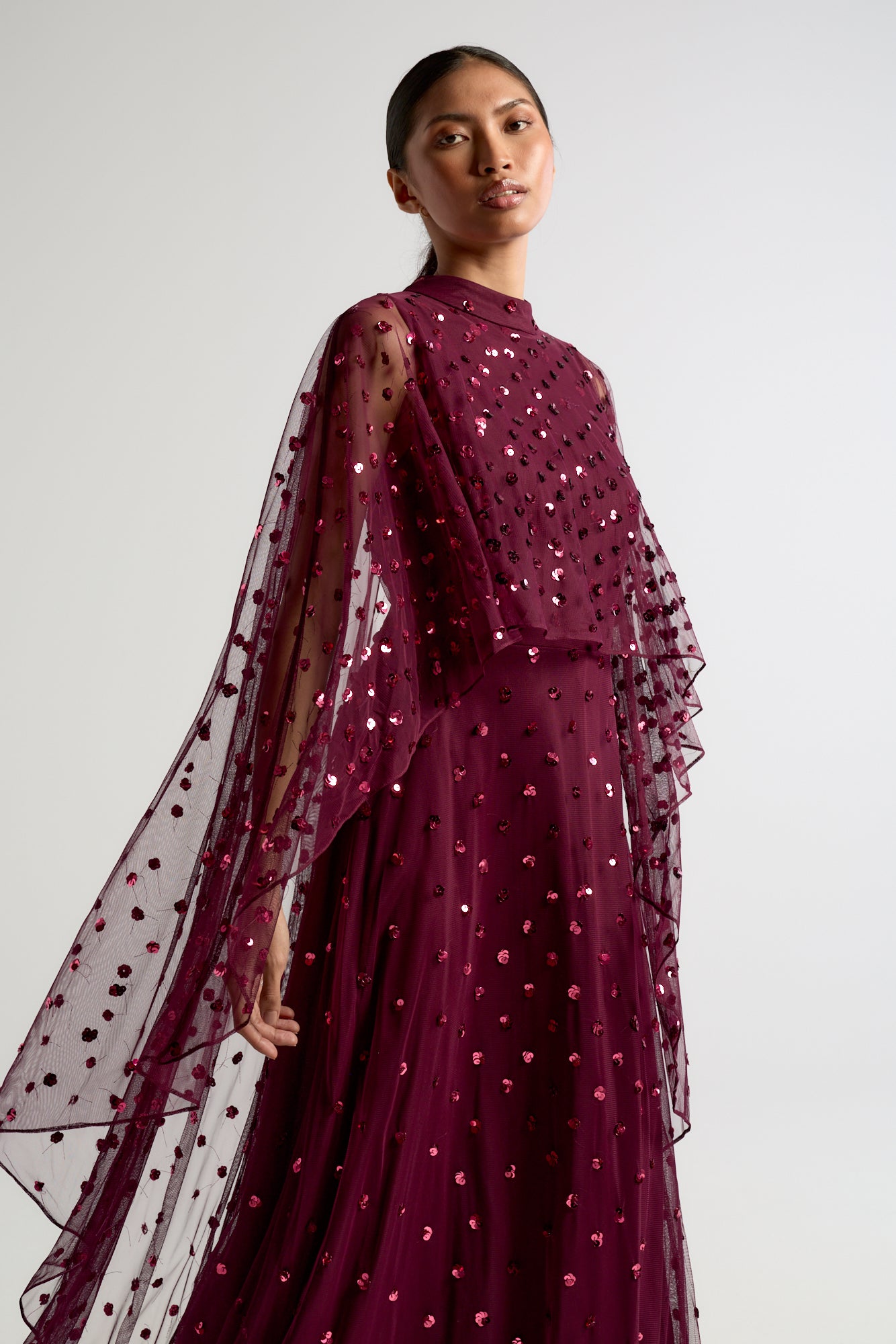 Elysia Purple Cape Dress with flowing floor-length silhouette, subtle sequin embellishments, and elegant cape overlay for weddings and evening occasions