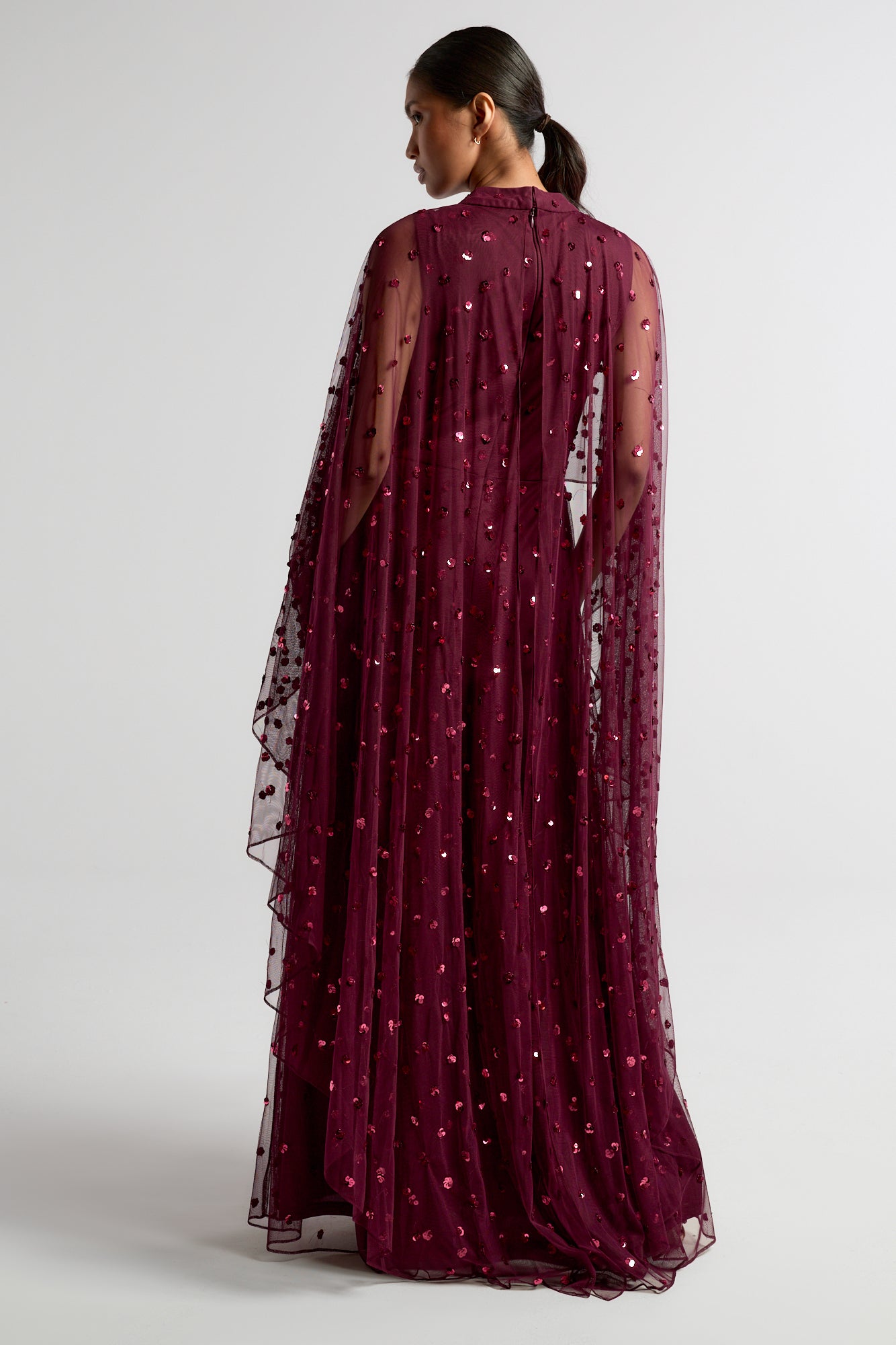 Elysia Purple Cape Dress with flowing floor-length silhouette, subtle sequin embellishments, and elegant cape overlay for weddings and evening occasions
