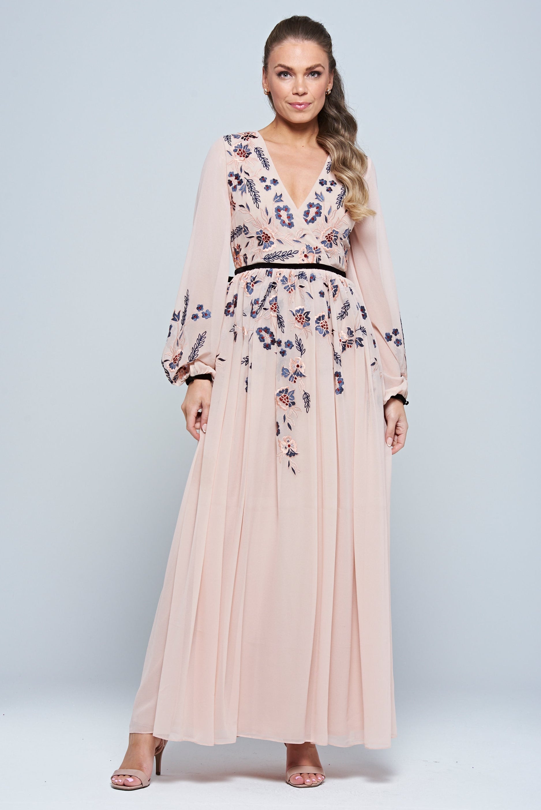 Erica Blush Floral Embroidered Maxi Dress by Frock and Frill, featuring long sleeves, V-neckline, and flowing maxi skirt in soft blush tones.