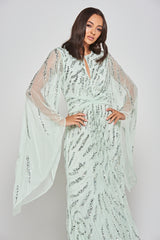 Genevieve mint green occasion maxi dress with silver sequin embellishment and statement sleeves.