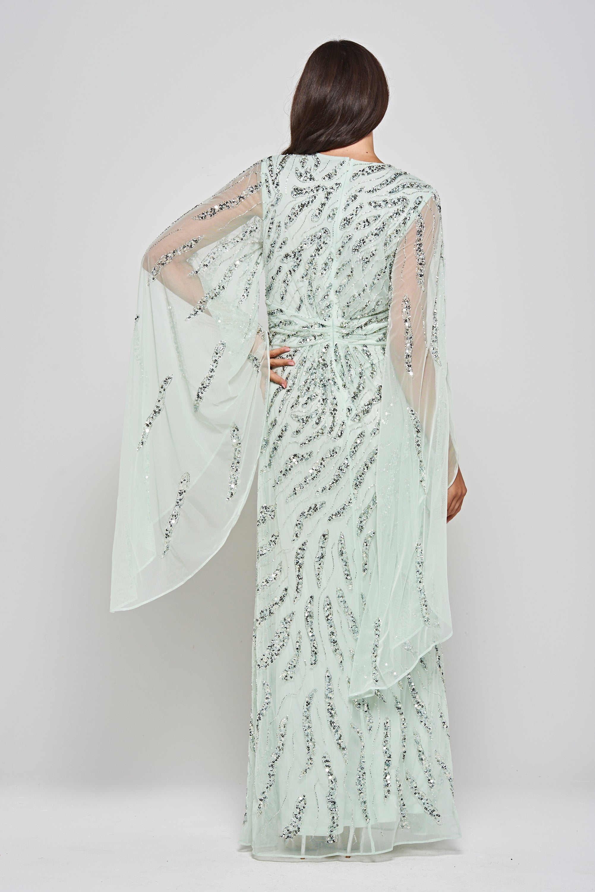 Genevieve mint green occasion maxi dress with silver sequin embellishment and statement sleeves.