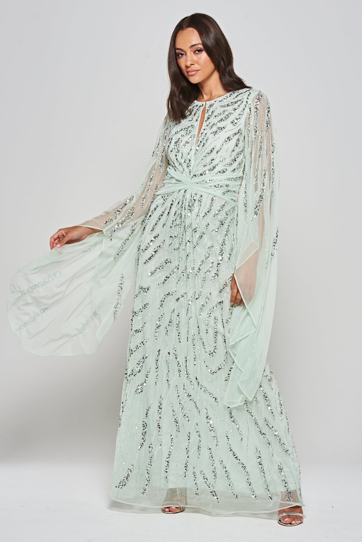 Genevieve mint green occasion maxi dress with silver sequin embellishment and statement sleeves.