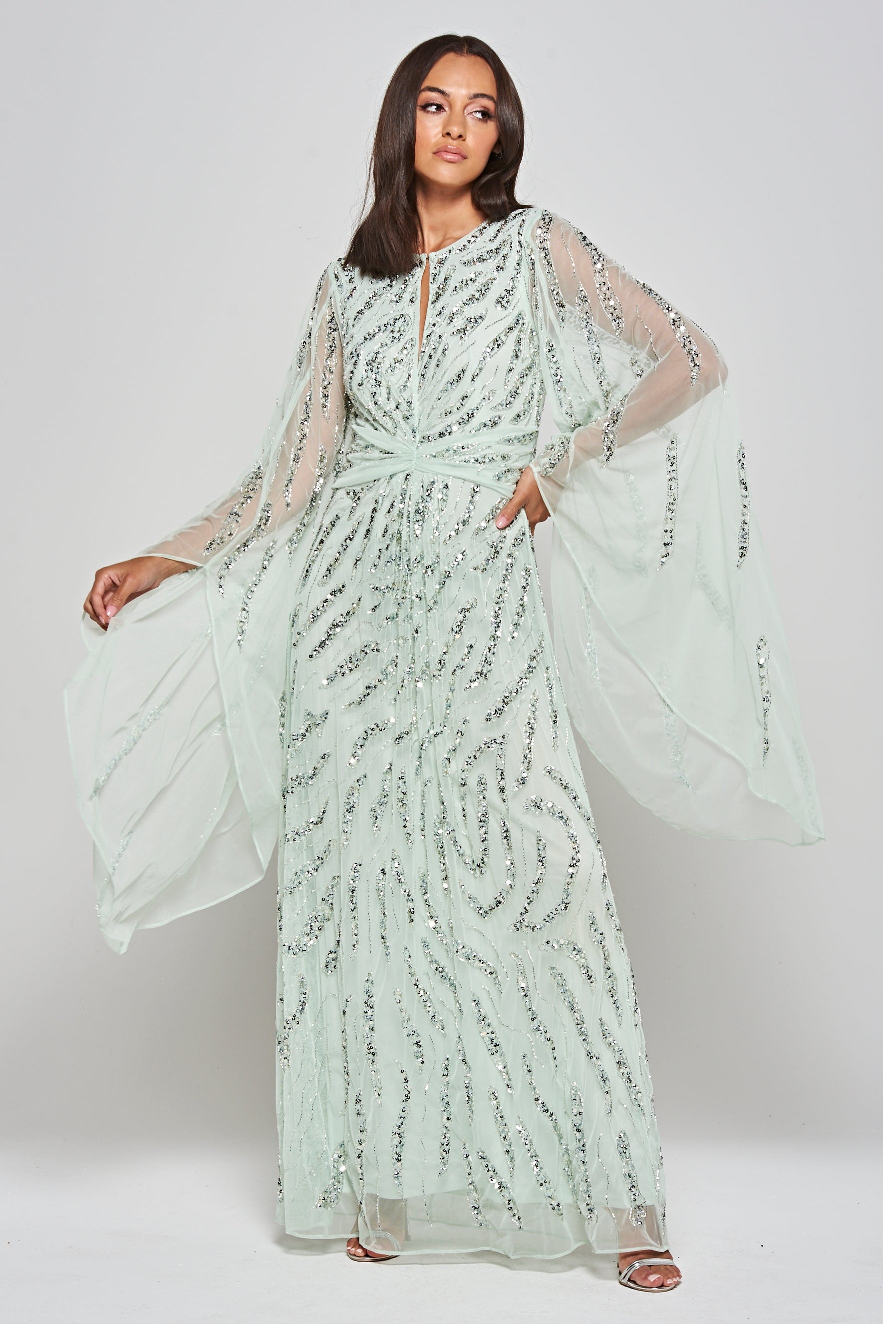 Genevieve mint green occasion maxi dress with silver sequin embellishment and statement sleeves.