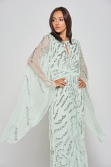 Genevieve mint green occasion maxi dress with silver sequin embellishment and statement sleeves.