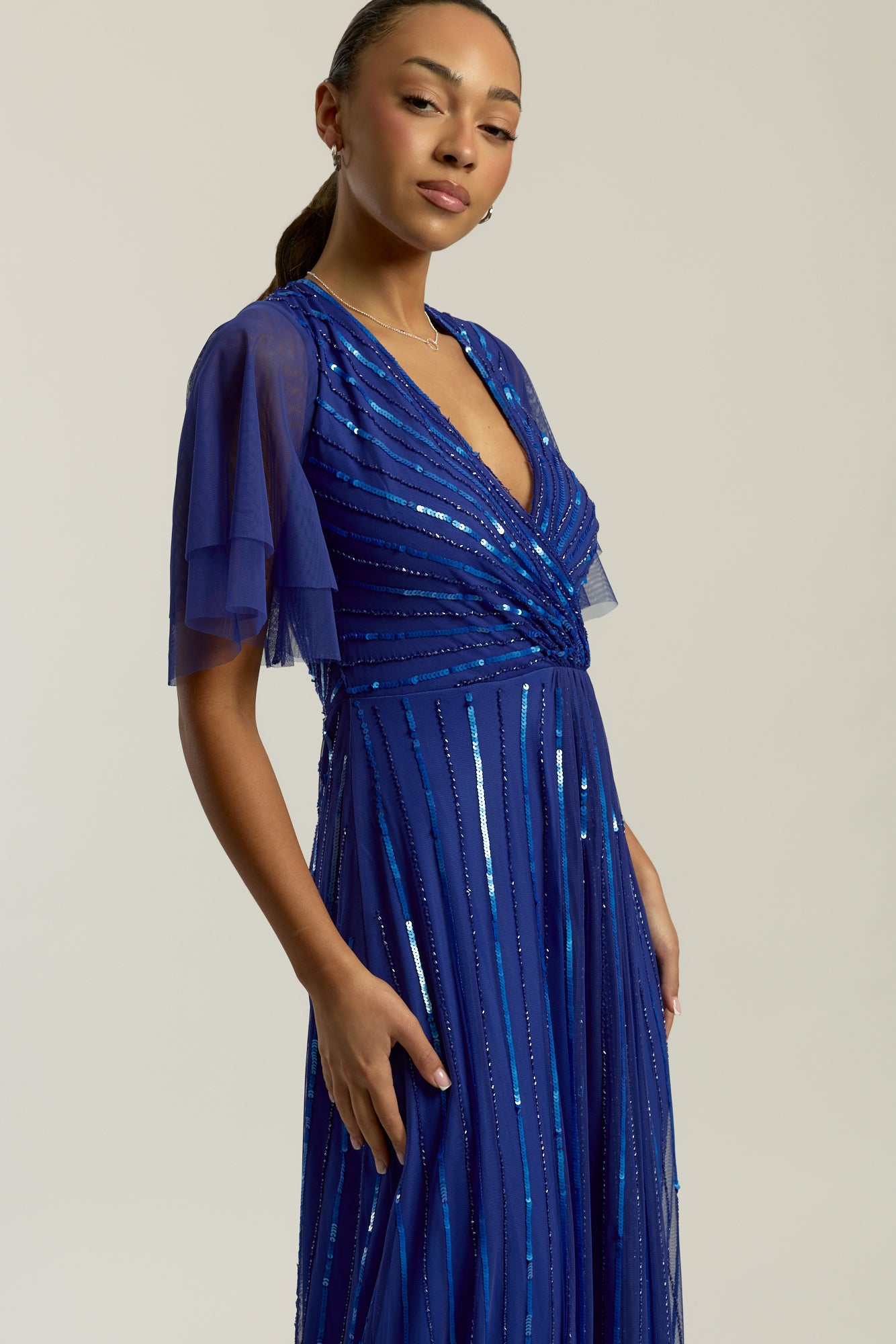 Harper Electric Blue Sequin Maxi Dress with v-neckline and full-length silhouette, perfect for weddings, balls, formal occasions and bridesmaids.