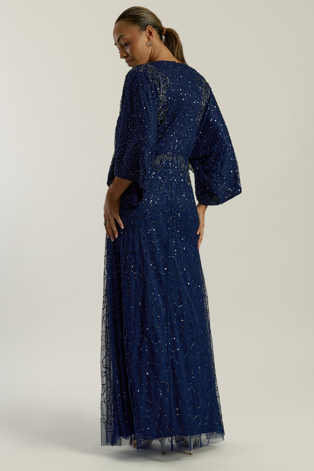 Judith Navy Embellished Maxi Dress with batwing sleeves, delicate beadwork, and flowing cape-style silhouette for weddings, evening events, and modest formal occasions
