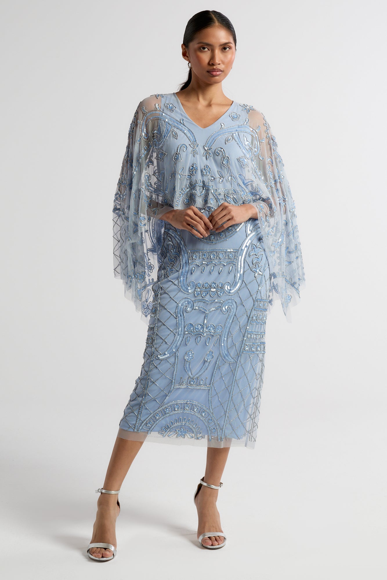 Juliana Blue Embellished Midi Dress With Cape Detail by Frock and Frill in cornflower blue with all-over beading and flowing cape overlay.