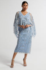 Juliana Blue Embellished Midi Dress With Cape Detail by Frock and Frill in cornflower blue with all-over beading and flowing cape overlay.