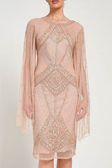 Liora blush embellished midi dress with intricate beading and sheer long sleeves. Perfect for parties and elegant evening occasions.