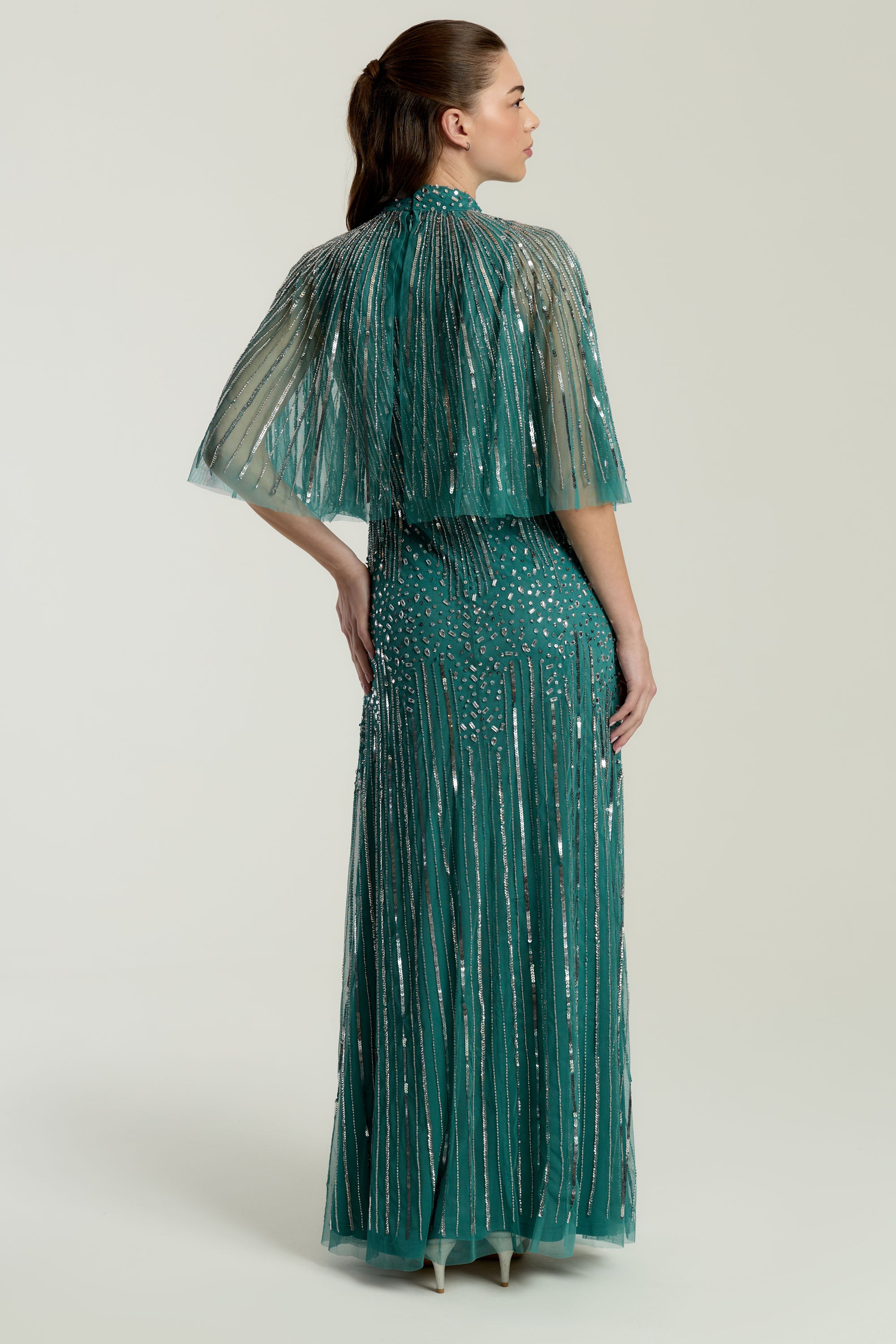 Lisette Teal Embellished Maxi Dress with Cape Detail, floor-length gown with all over beading and sheer cape sleeves, suitable for weddings and evening events