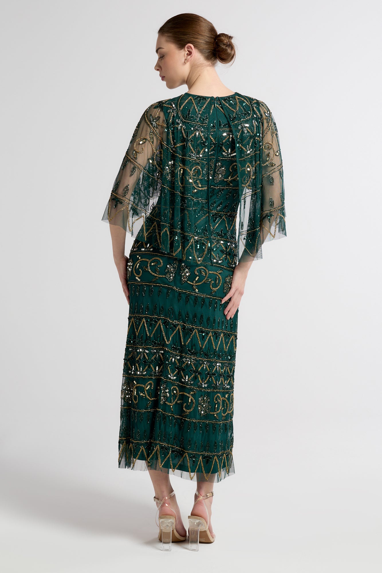 Mahonia by Frock and Frill green embellished midaxi dress with cape sleeves. 