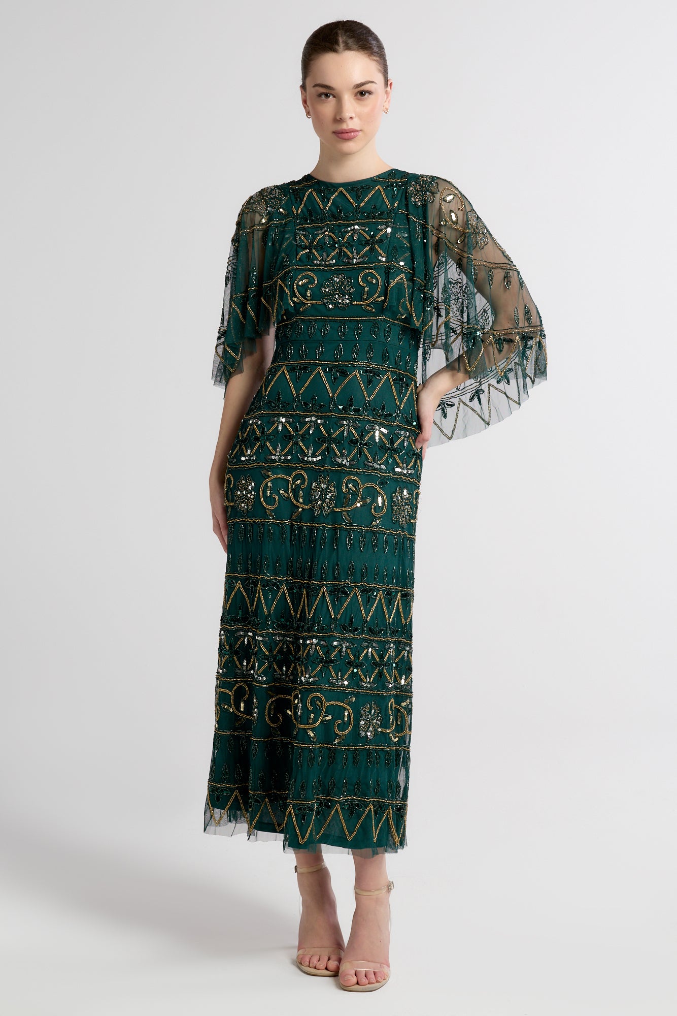 Mahonia by Frock and Frill green embellished midaxi dress with cape sleeves. 