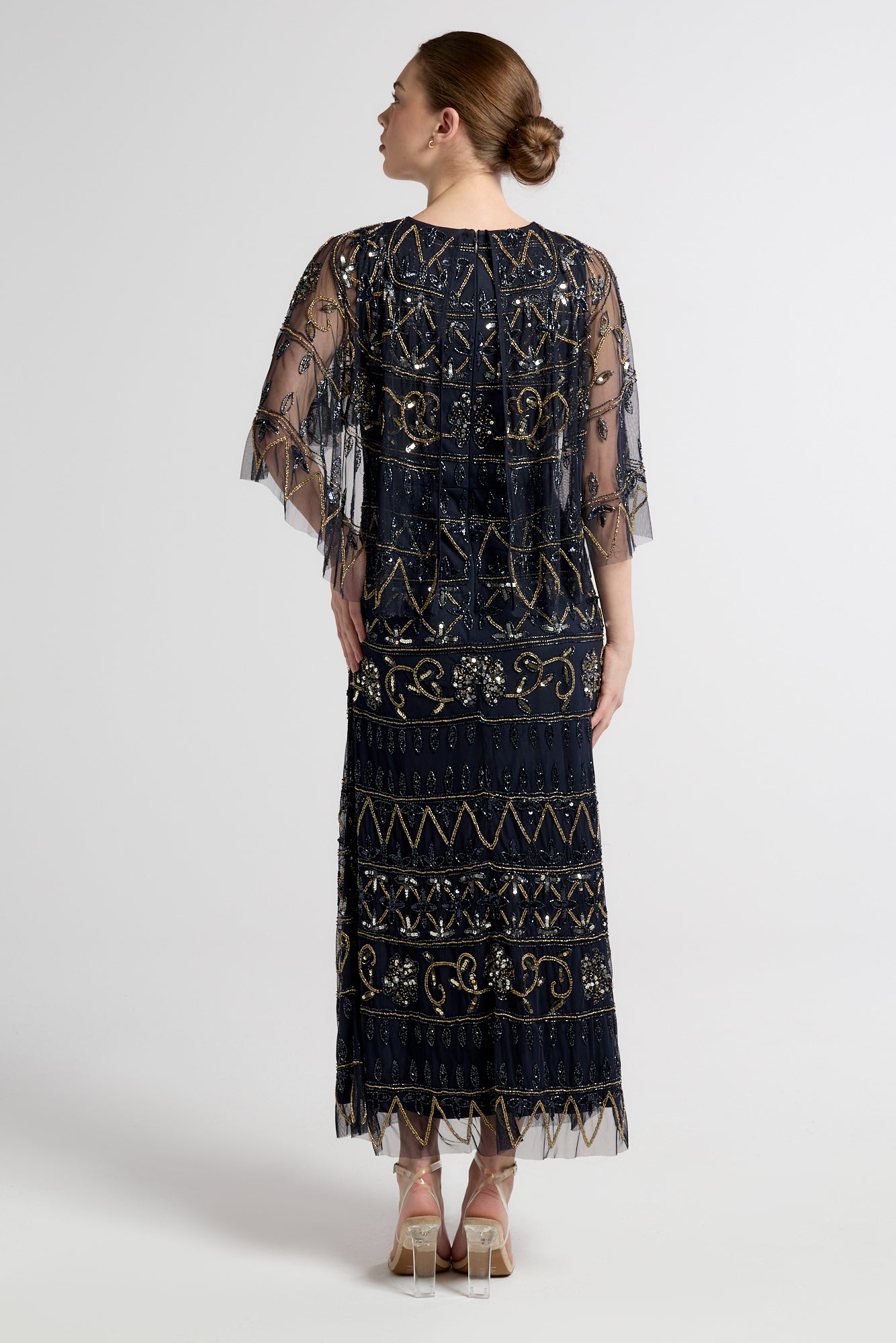 Navy Mahonia cape sleeve midaxi dress from Frock and Frill, fully embellished with sparkling beads, featuring a flowing skirt, perfect for weddings, parties, and modest evening occasions
