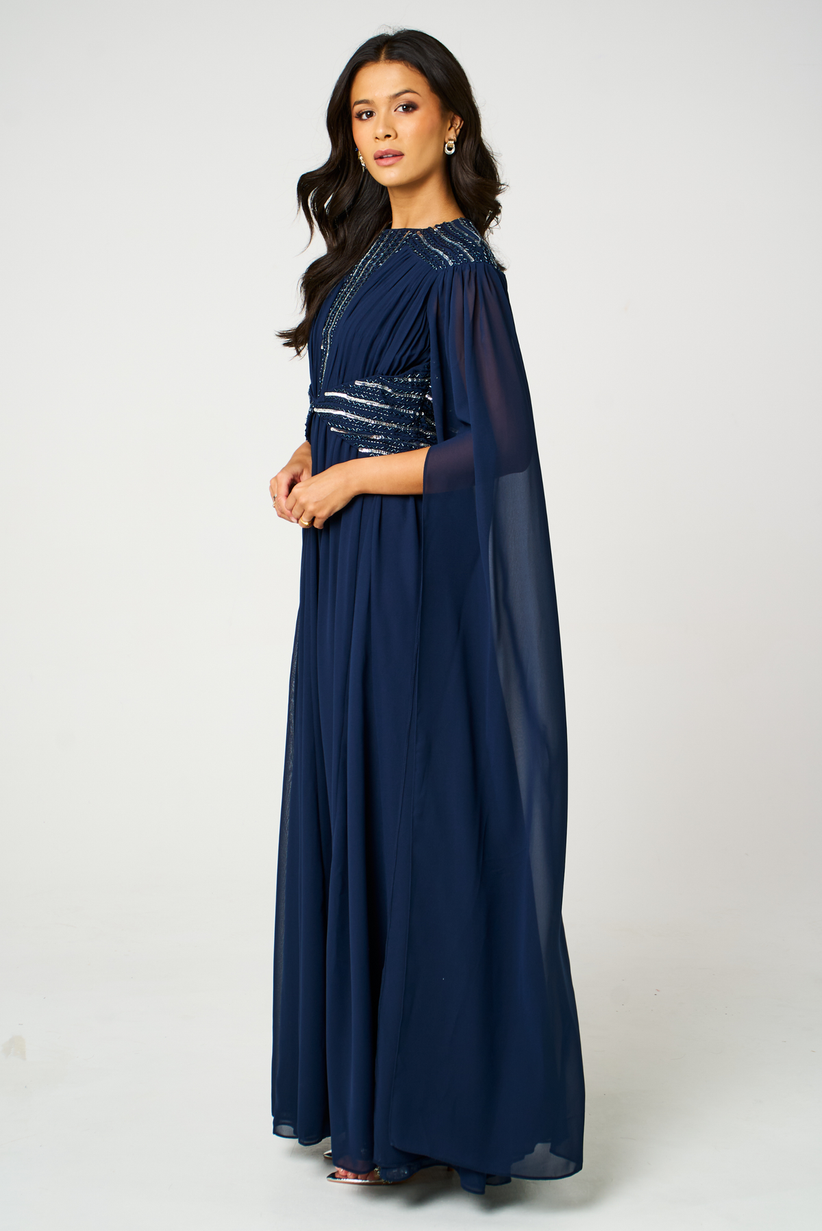 Marina navy embellished maxi dress with flowing silhouette and delicate bead detailing, ideal for weddings and formal occasions.