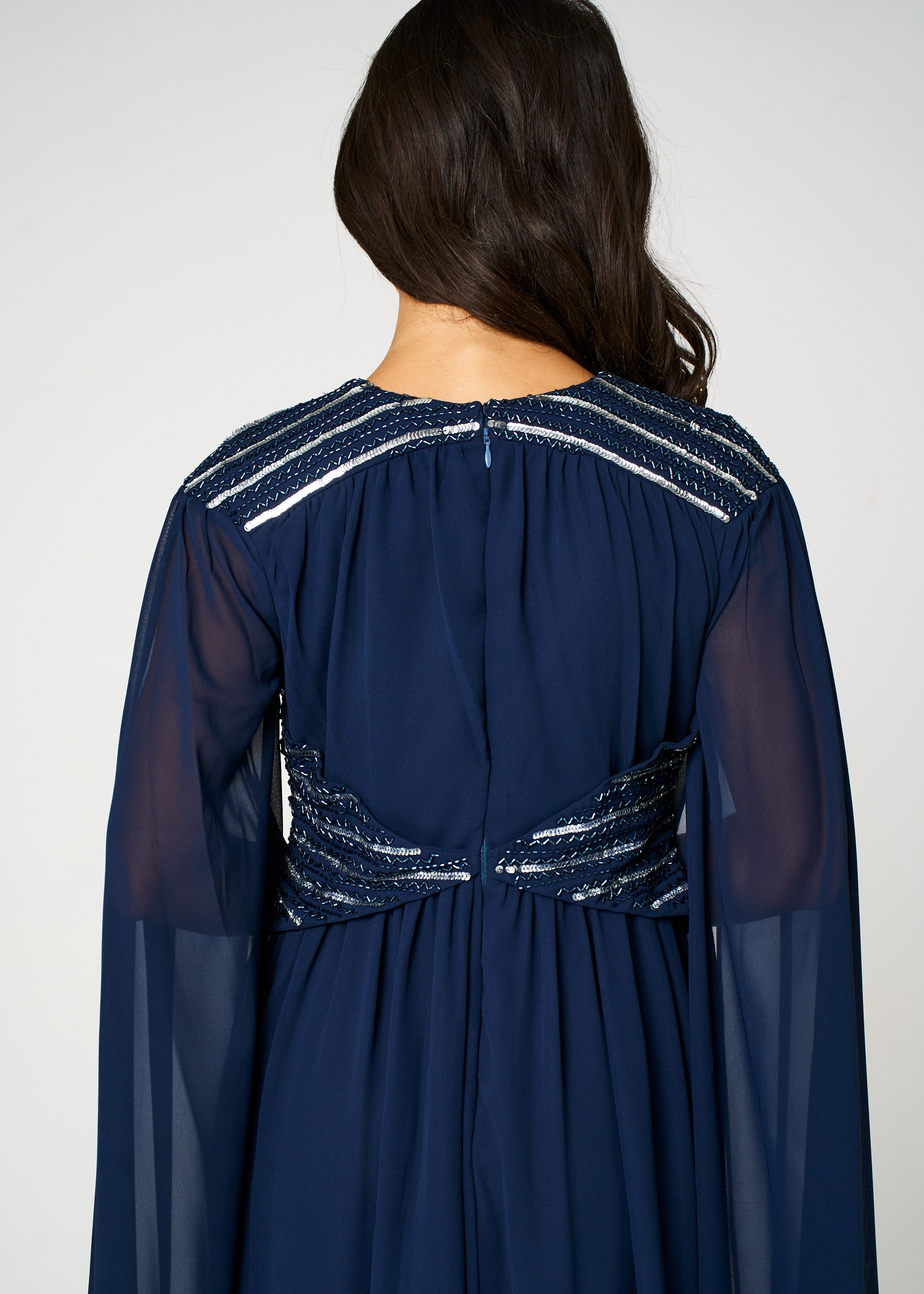 Marina navy embellished maxi dress with flowing silhouette and delicate bead detailing, ideal for weddings and formal occasions.