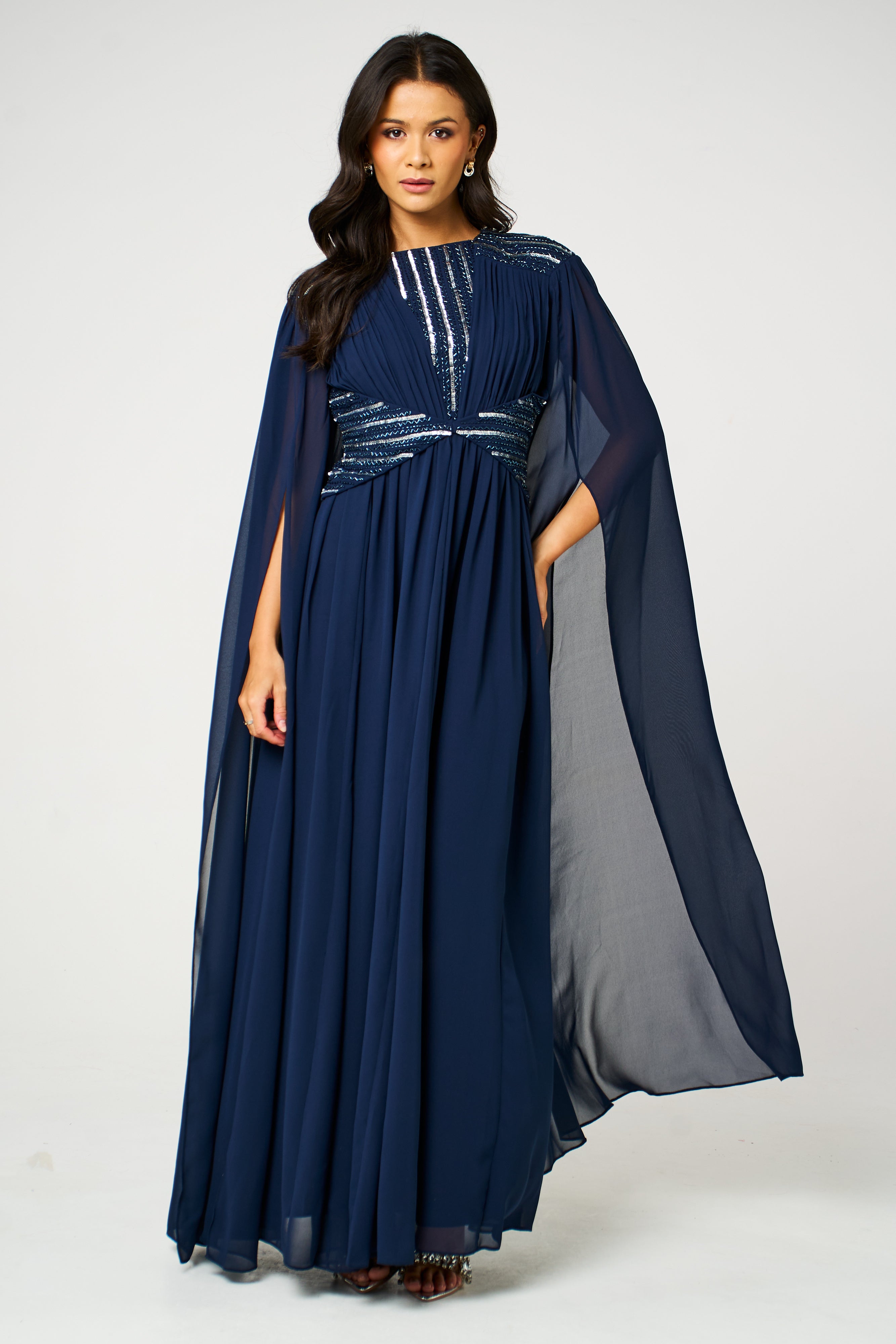 Marina navy embellished maxi dress with flowing silhouette and delicate bead detailing, ideal for weddings and formal occasions.