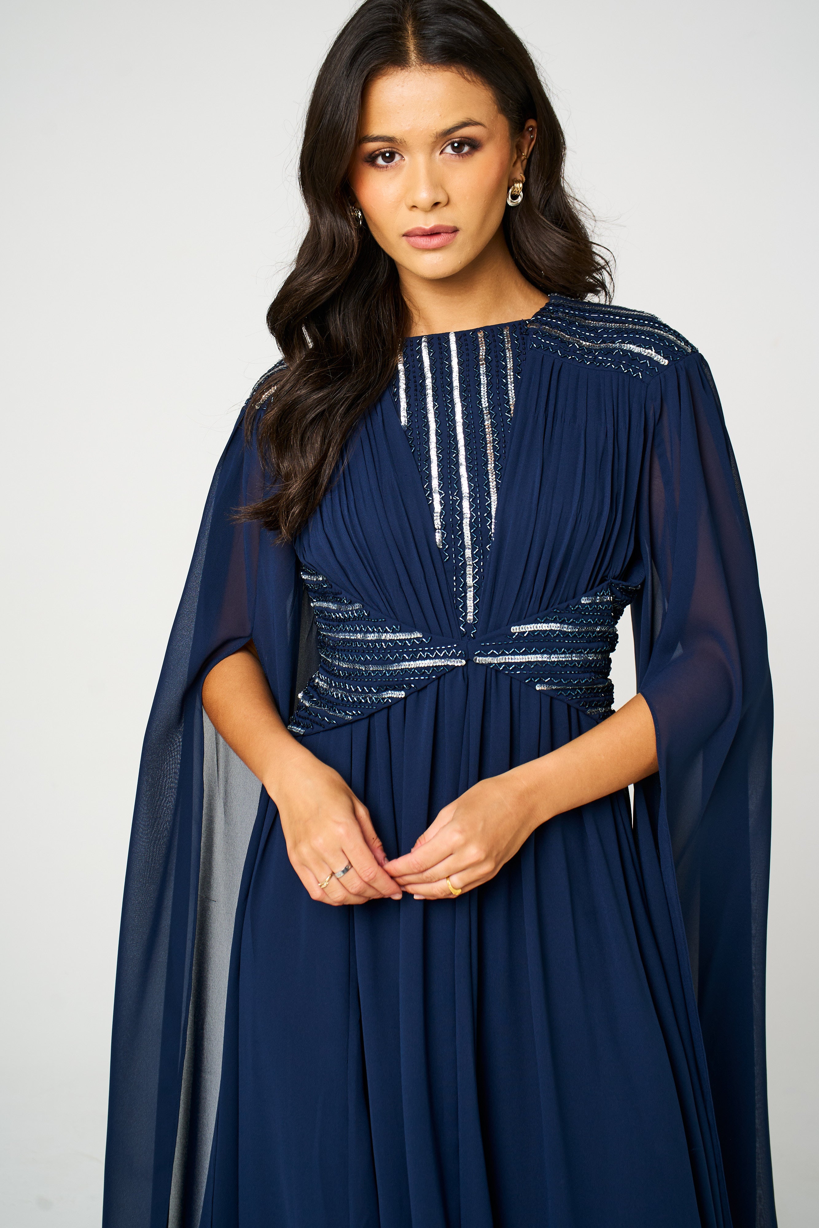 Marina navy embellished maxi dress with flowing silhouette and delicate bead detailing, ideal for weddings and formal occasions.