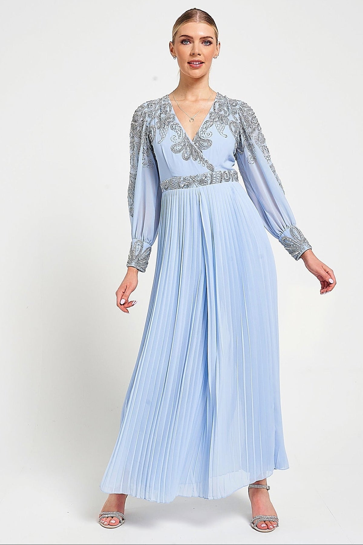 Meredith Blue Embellished Jumpsuit in ice blue with beaded bodice, long sheer sleeves and pleated wide-leg trousers for weddings and formal occasions.