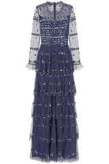 Nerissa dusty navy blue sequin tiered maxi dress with full-length sleeves, perfect for weddings, black tie balls and formal occasions. 