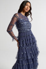Nerissa dusty navy blue sequin tiered maxi dress with full-length sleeves, perfect for weddings, black tie balls and formal occasions. 