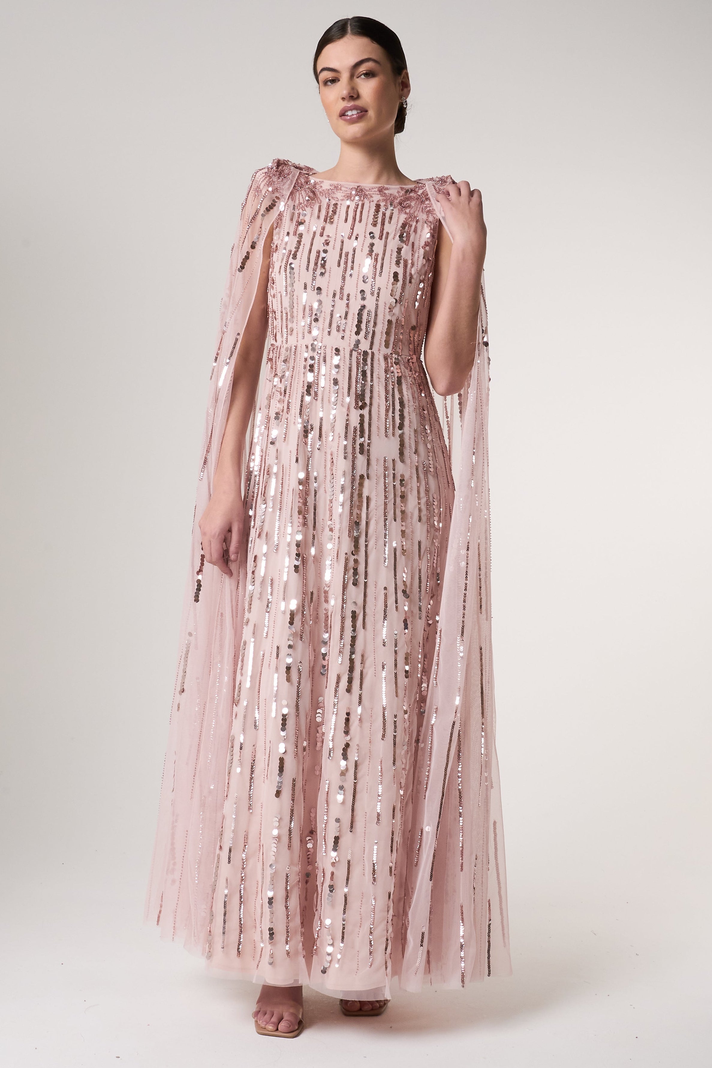 Peony pink embellished cape sleeve maxi dress with sheer long cape sleeves and cascading sequin detailing