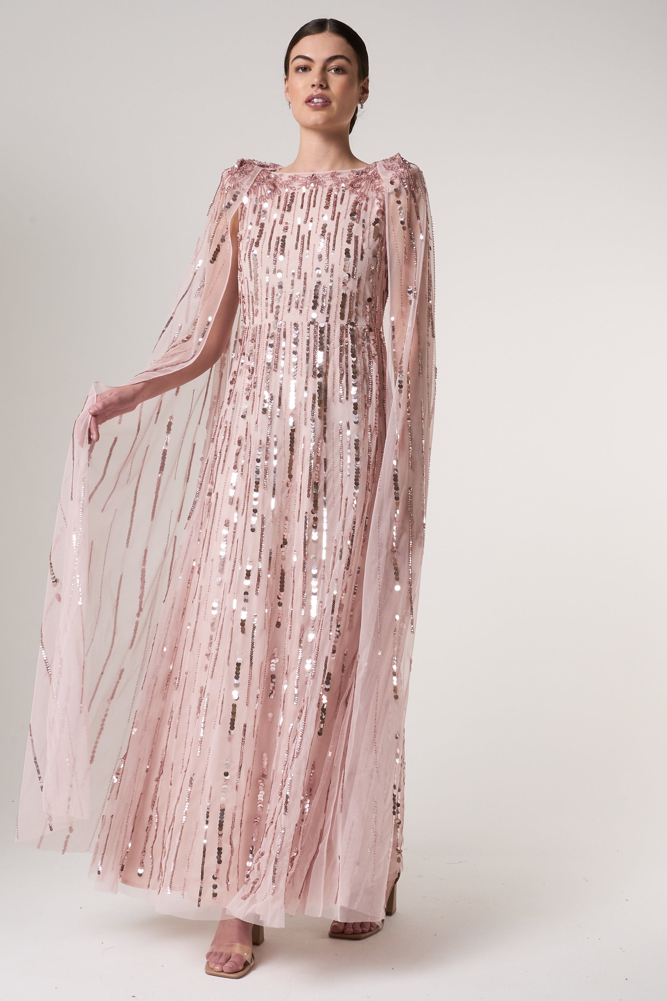 Peony pink embellished cape sleeve maxi dress with sheer long cape sleeves and cascading sequin detailing