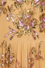 Saffron yellow gold embellished maxi dress with floral beading, sheer three-quarter sleeves and flowing skirt by Frock and Frill.