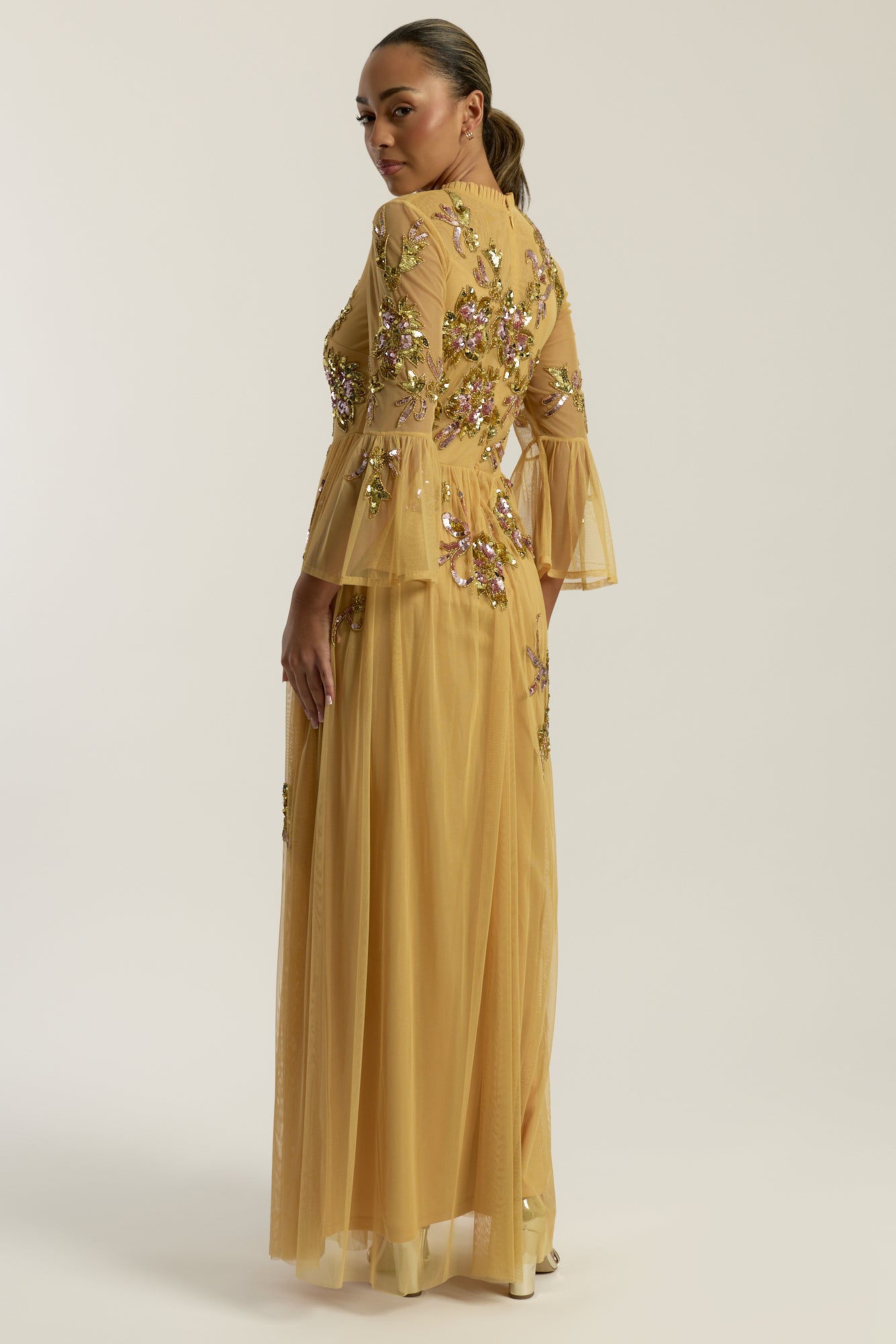 Saffron yellow gold embellished maxi dress with floral beading, sheer three-quarter sleeves and flowing skirt by Frock and Frill.