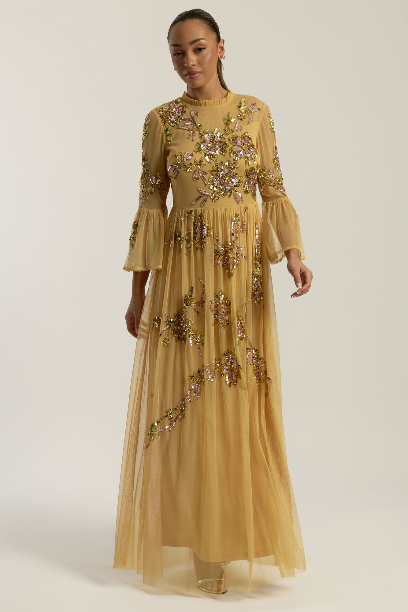 Saffron yellow gold embellished maxi dress with floral beading, sheer three-quarter sleeves and flowing skirt by Frock and Frill.