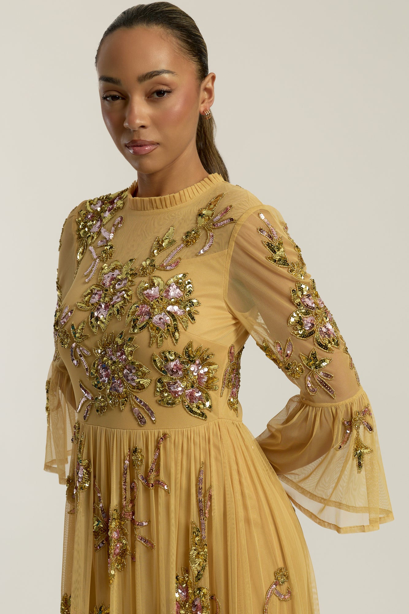 Saffron yellow gold embellished maxi dress with floral beading, sheer three-quarter sleeves and flowing skirt by Frock and Frill.