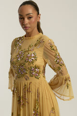 Saffron yellow gold embellished maxi dress with floral beading, sheer three-quarter sleeves and flowing skirt by Frock and Frill.