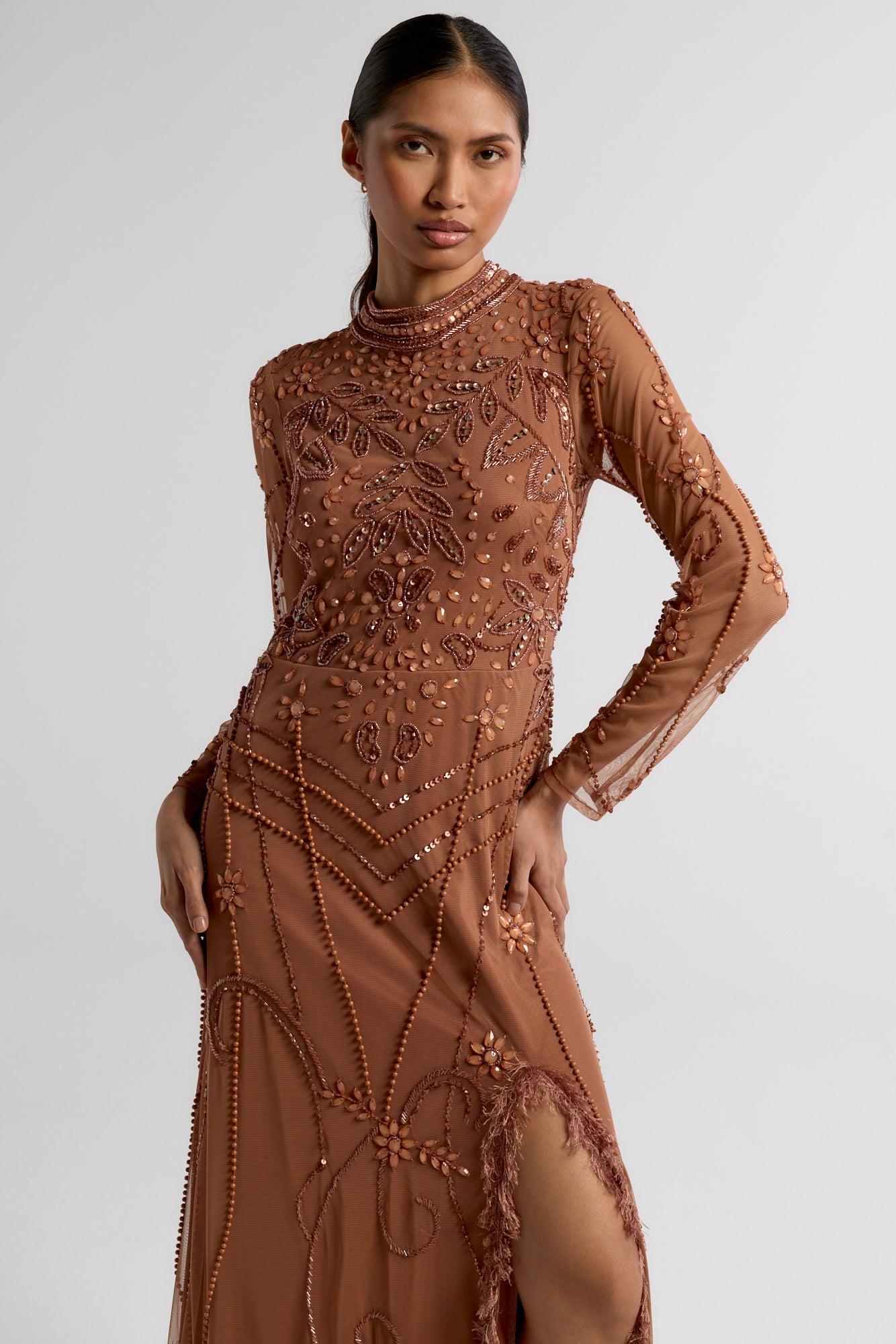 Solene bronze embellished maxi dress with high neckline, side split skirt, and open back, perfect for weddings, formal occasions, and evening events.